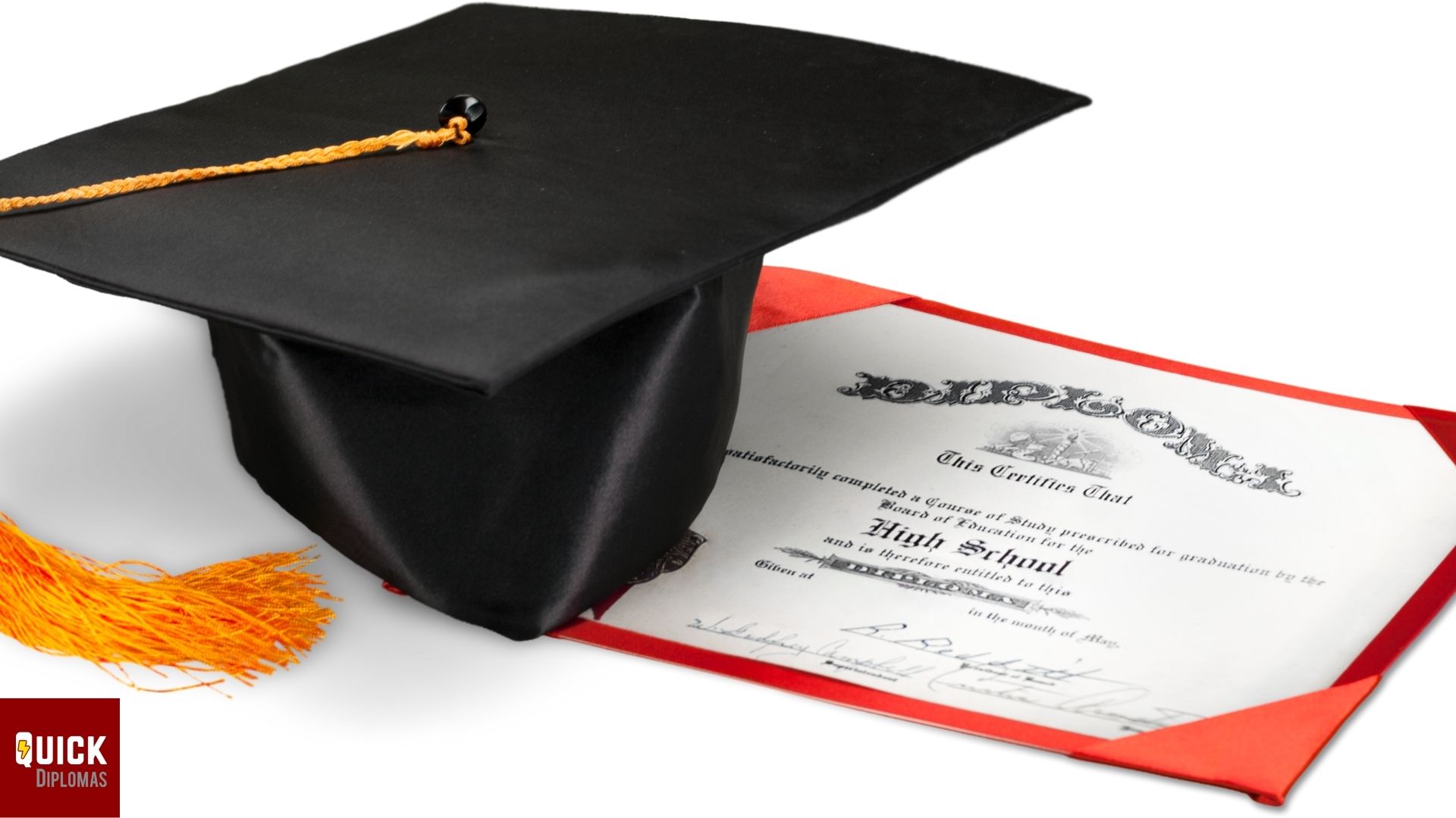 black graduation cap with tassel on top of diploma